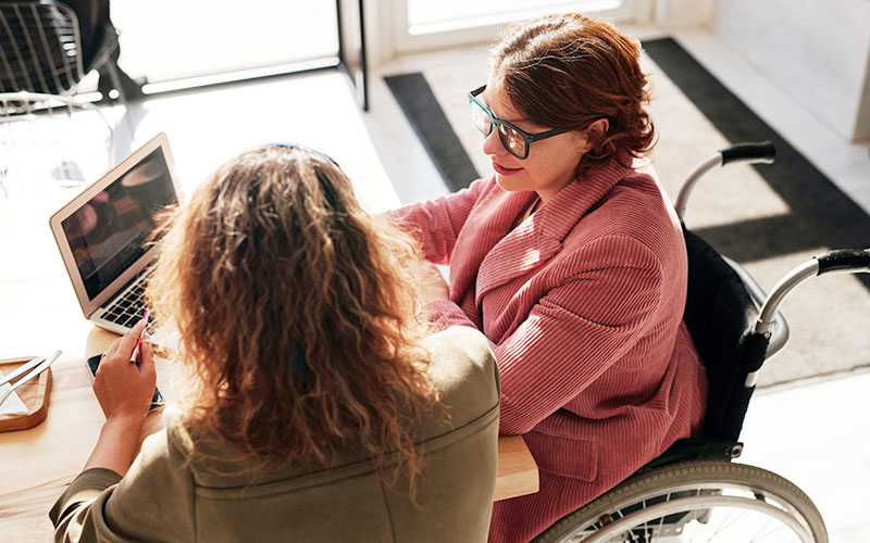 two woman discussing disability insurance